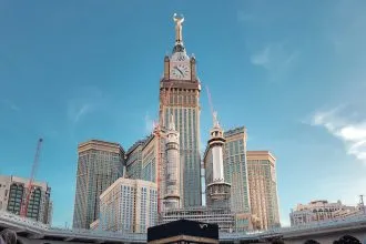 a group of people standing in front of a tall building